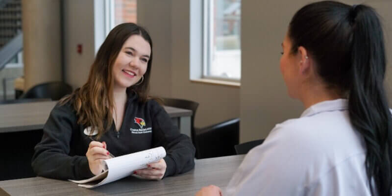 A Campus Recreation employee provides a consultation.